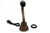 Decorative lamp with a long neck and base on a white background